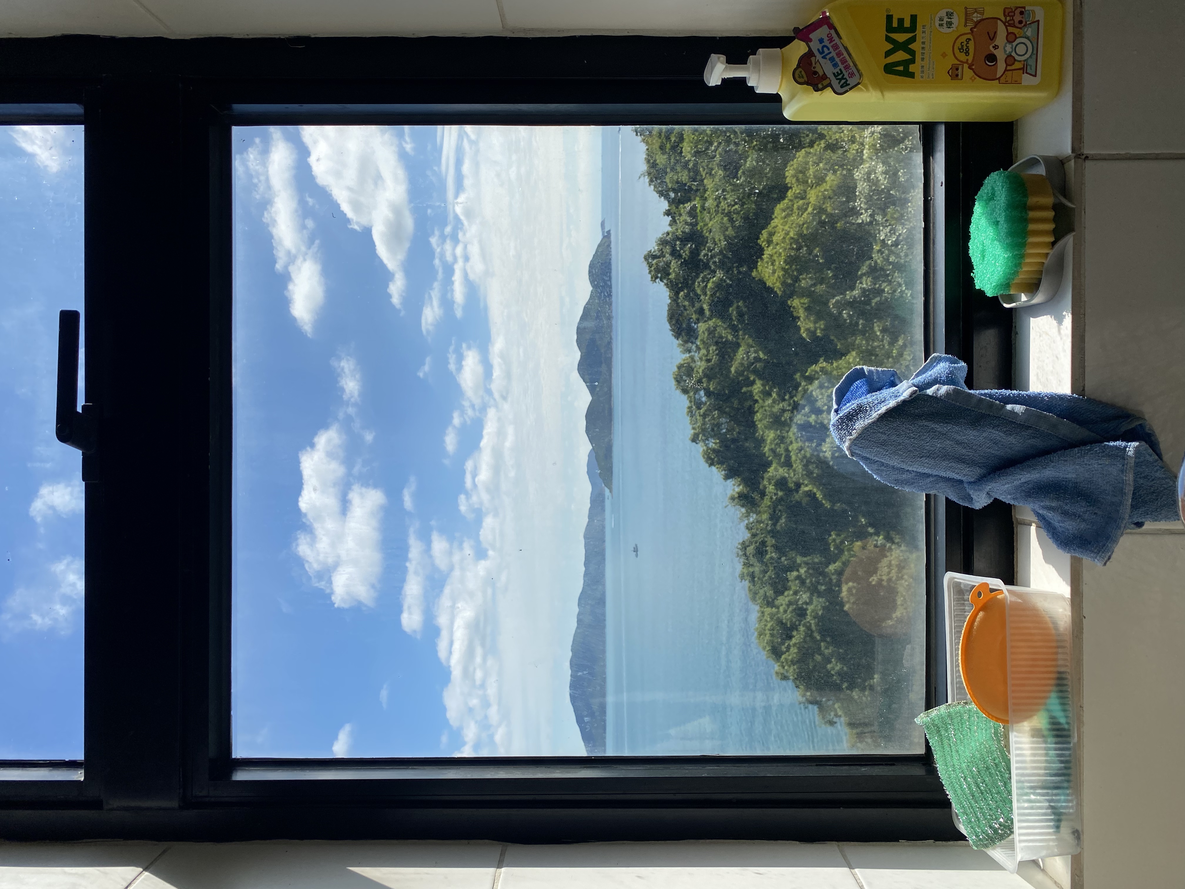 Window view of the sea & mountains